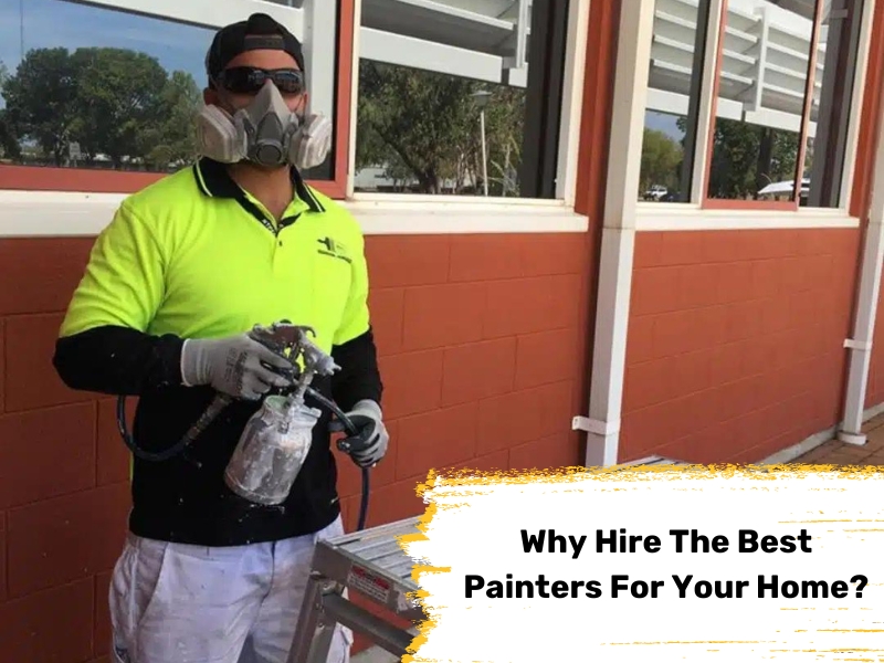 Professional painter in safety gear holding spray gun for exterior painting. Best painters ensure quality home finishes